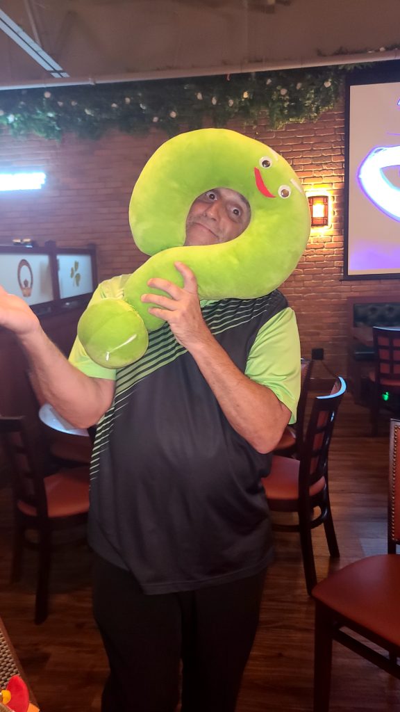 Mark Marino holding a question mark plush made by a fan.